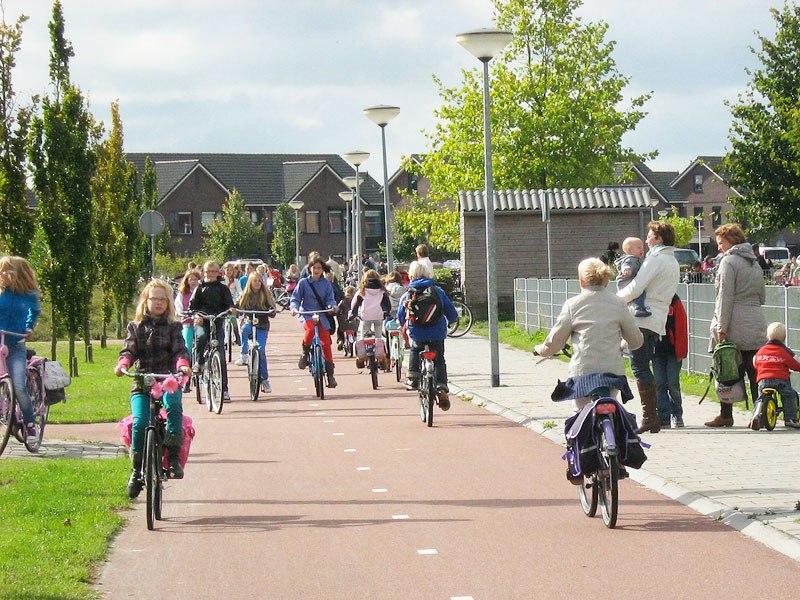The children in this photo are too young to have taken their school cycling lessons, yet are already cycling to and from school.